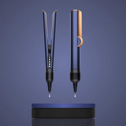 Blue and gold hair straightener with buttons and vented base on blue background