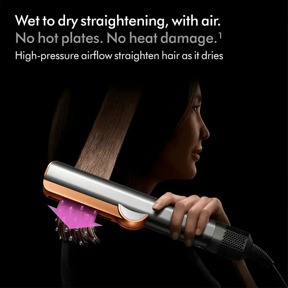 Woman using a heat-free hair straightener with high-pressure airflow to dry and straighten hair