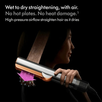 Woman using a heat-free hair straightener with high-pressure airflow to dry and straighten hair
