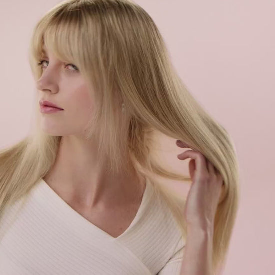 Woman using Air Straightener to dry and straighten hair