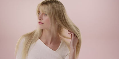 Woman using Air Straightener to dry and straighten hair